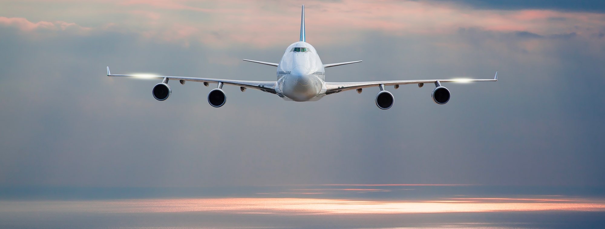 a jet flying in the clouds