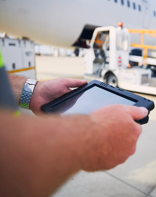 Closeup of a delivery person using a tablet